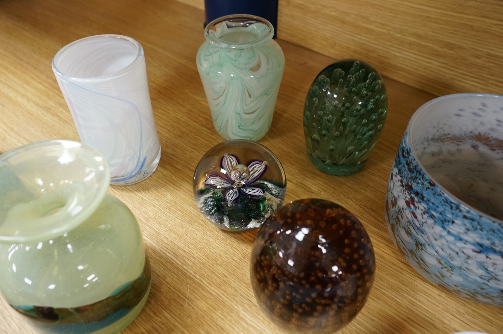 A collection of mixed art glass and paperweights, including two Mdina flared rimmed glass vases, Adrian Shankey glass, an Isle of Wight squat vase, various paperweights and a dump etc. (15)